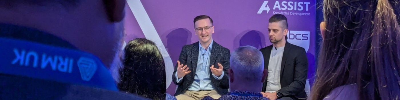 Daniel Ziekenoppasser-Powell speaking at a panel